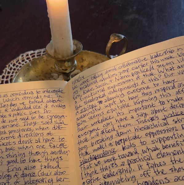 A photo of an open page of the site author's ministry journal, resting on a candle-stick holder. The flame of the candle is just out of view.